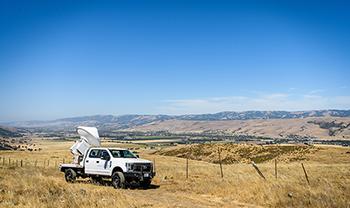 truck from the wildfire center sits in open field